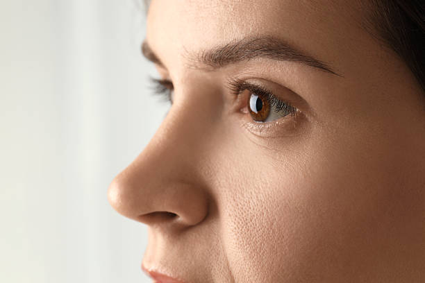 istock Woman with beautiful eyes on light background, closeup 2232518561