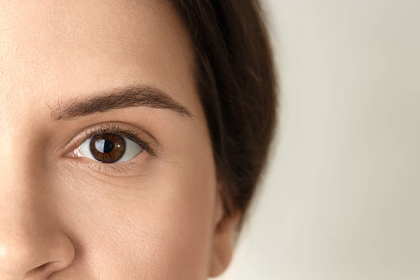 istock Woman with beautiful eyes on light background, closeup 2232518589