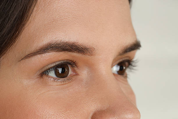 istock Woman with beautiful eyes on light background, closeup 2232518593