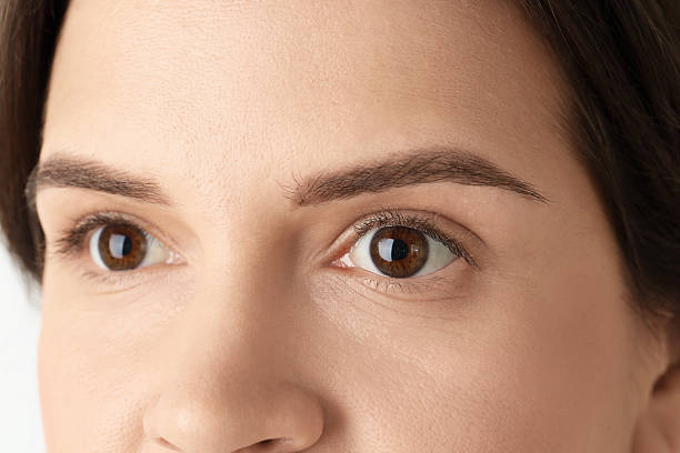 istock Woman with beautiful eyes on light background, closeup 2232518621