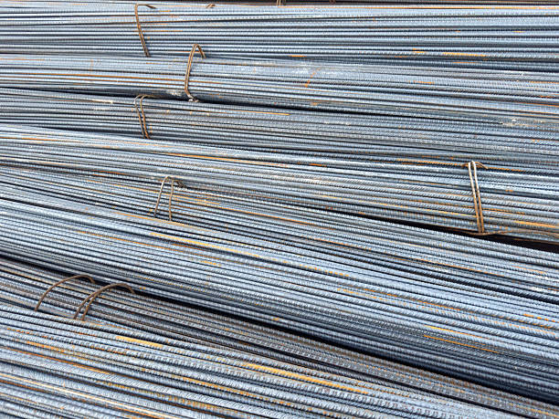 istock Stacked Steel Rebars in Closeup Showing Texture and Construction Material 2232520146