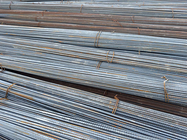 istock Stacked Steel Rebars in Closeup Showing Texture and Construction Material 2232520197