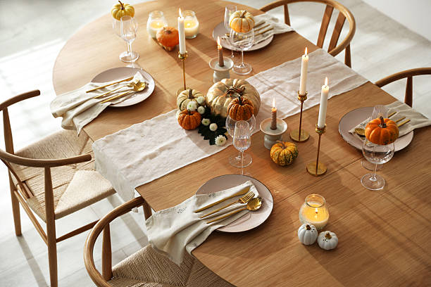 istock Stylish dining room with beautiful table setting and autumn decor 2232521023