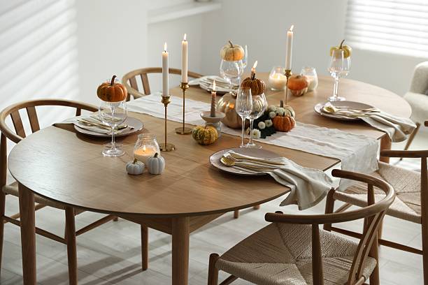 istock Stylish dining room with beautiful table setting and autumn decor 2232521030