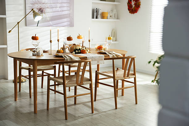 istock Stylish dining room with beautiful table setting and autumn decor 2232521034