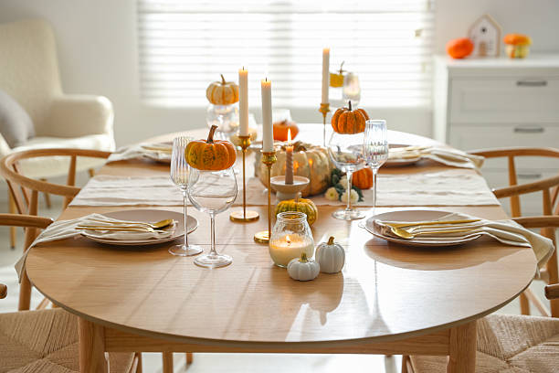 istock Stylish dining room with beautiful table setting and autumn decor 2232521044