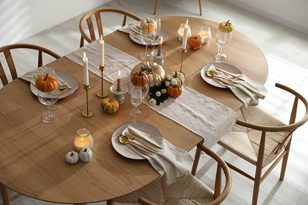 istock Stylish dining room with beautiful table setting and autumn decor 2232521046