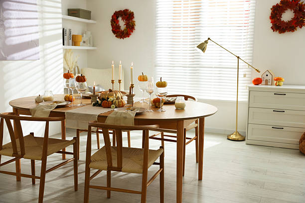 istock Stylish dining room with beautiful table setting and autumn decor 2232521064
