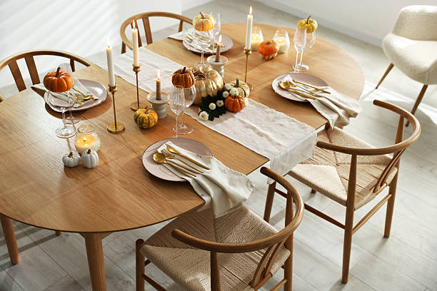 istock Stylish dining room with beautiful table setting and autumn decor 2232521075