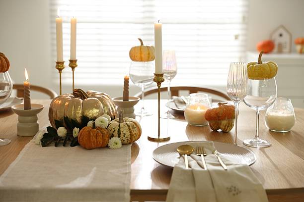 istock Stylish table setting with beautiful dishware, glasses and autumn decor in dining room 2232521095