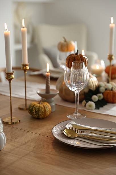 istock Stylish table setting with beautiful dishware, glasses and autumn decor in dining room 2232521103