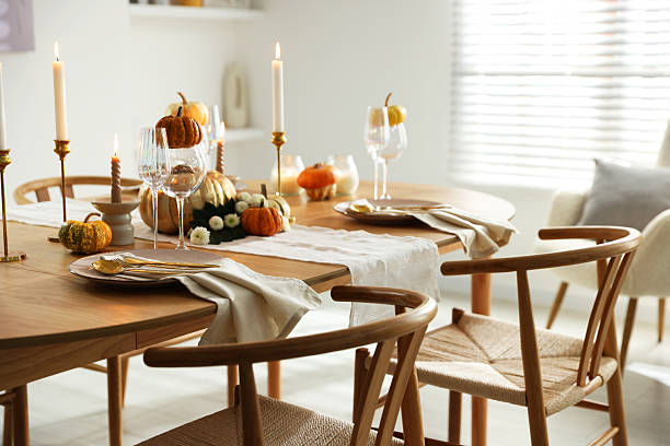 istock Stylish dining room with beautiful table setting and autumn decor 2232521135