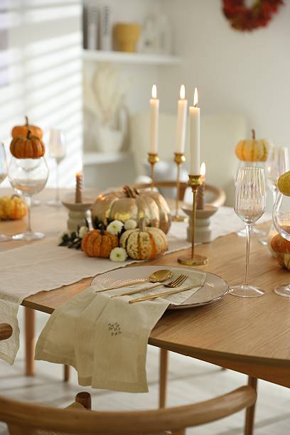 istock Stylish table setting with beautiful dishware, glasses and autumn decor in dining room 2232521141