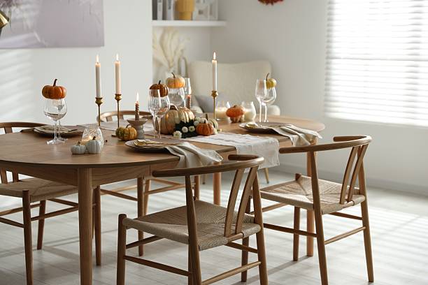 istock Stylish dining room with beautiful table setting and autumn decor 2232521156