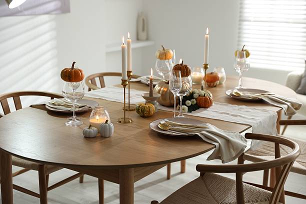 istock Stylish dining room with beautiful table setting and autumn decor 2232521161