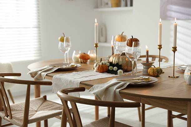 istock Stylish dining room with beautiful table setting and autumn decor 2232521168