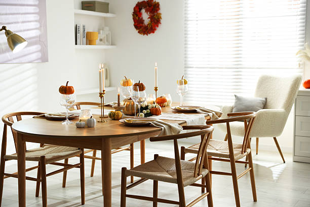 istock Stylish dining room with beautiful table setting and autumn decor 2232521177