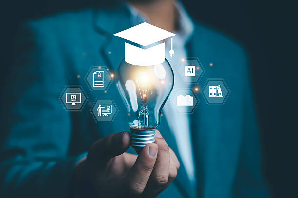 istock Creative concept of education and innovation with a glowing light bulb and graduation cap symbolizing knowledge, e-learning, education, learning, and academic success for the future. 2232521676