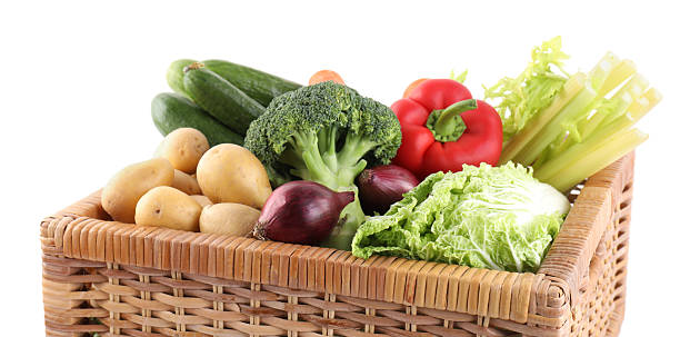 istock Different ripe vegetables in wicker box isolated on white 2232523583