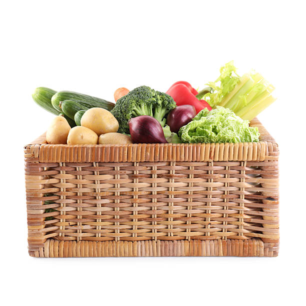 istock Different ripe vegetables in wicker box isolated on white 2232524342