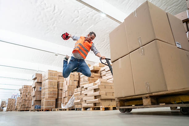 istock Warehouse Worker Jumping with Energy in a Heavy Duty Storage Facility 2232527785