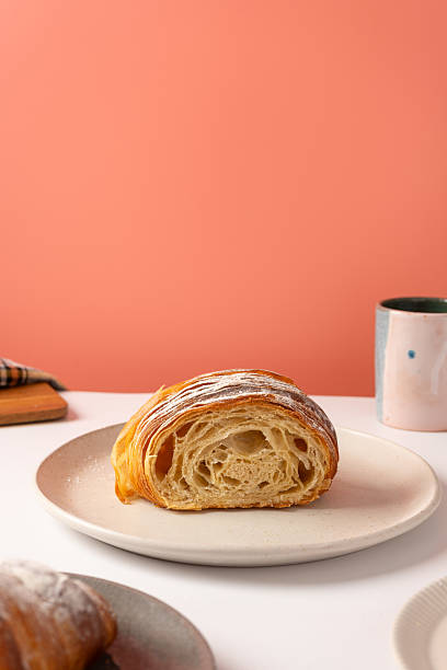 istock Sliced croissant on a pink background 2232529174