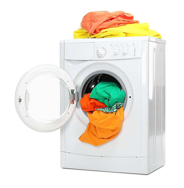istock Washing machine full of colorful clothes isolated on white 2232532700