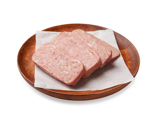 istock Pieces of canned meat isolated on white 2232534273