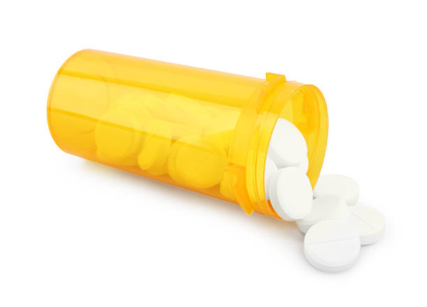 istock Antibiotic pills with medical bottle on white background 2232536842