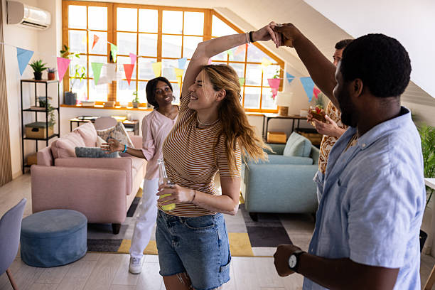 istock Friends Dancing at Birthday Party 2232536899