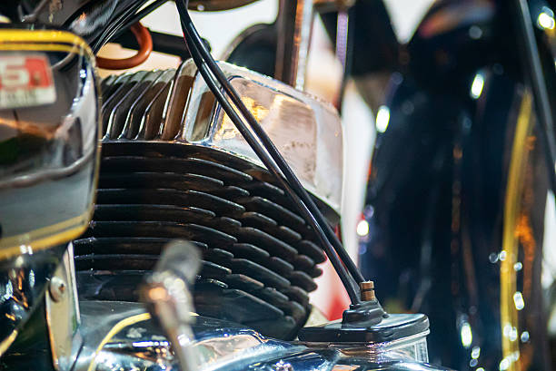 Explore the intricate details of a classic motorcycle engine with a focus on chrome components, showcasing craftsmanship and vintage aesthetic in this close-up.