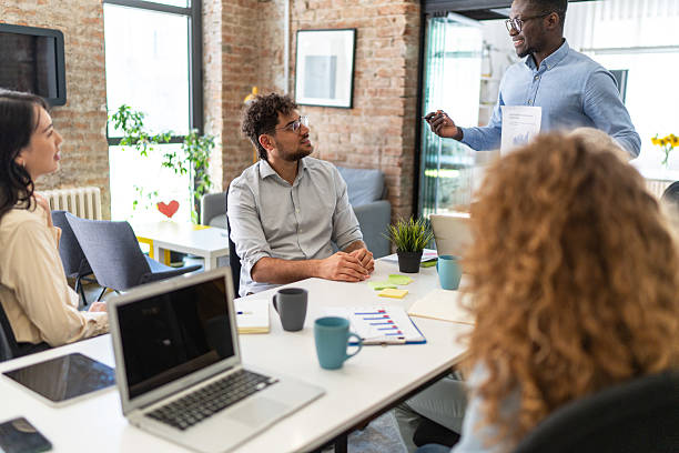 istock Diverse business team analyzing charts during a meeting 2232539307