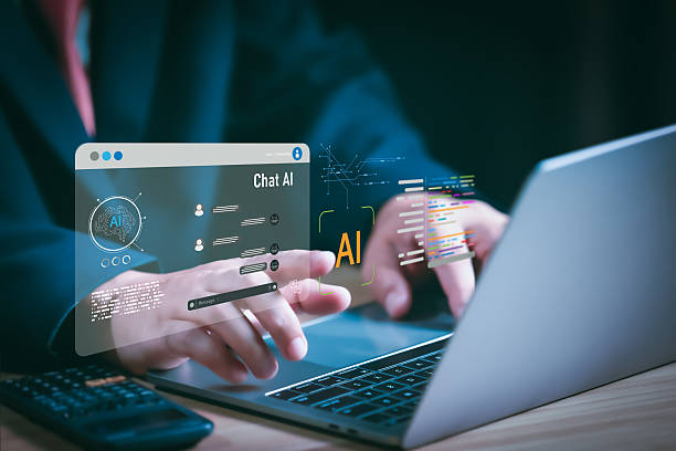 istock Businessman using laptop with futuristic AI chatbot interface, digital technology, and artificial intelligence innovation concept for customer support, automation, and virtual assistant solutions. 2232541447