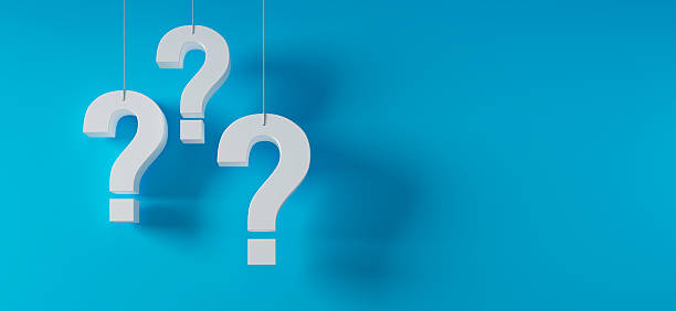 istock Three hanging white question marks in front of a turquoise background 2232542646