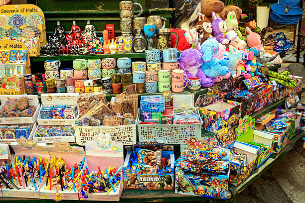 Valletta, Malta - August 26, 2025: Street stall in Malta with mugs, toys, magnets, and gifts for tourists.