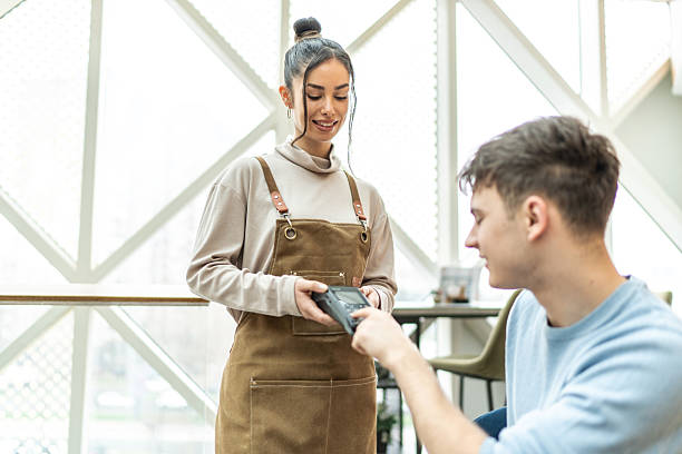 istock Customer paying with contactless payment in coffee shop 2232543611