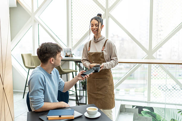 istock Customer paying with contactless payment in coffee shop 2232543635
