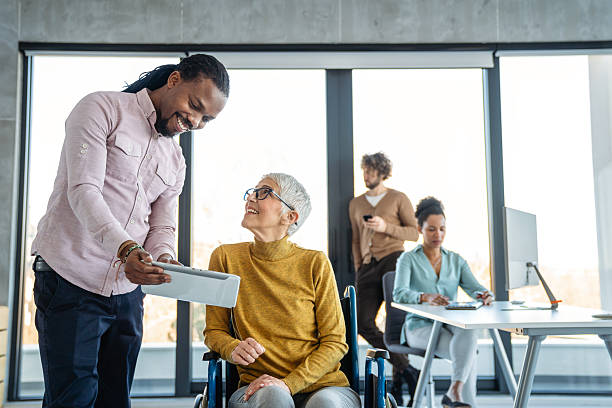 istock Multiracial coworkers analyzing charts and working together showing teamwork diversity and inclusion 2232543811