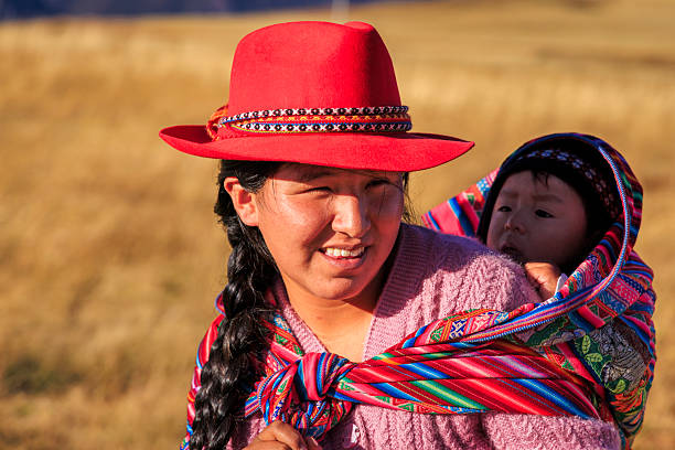 istock Young mother carrying her baby, Urubamba Valley 2232547607