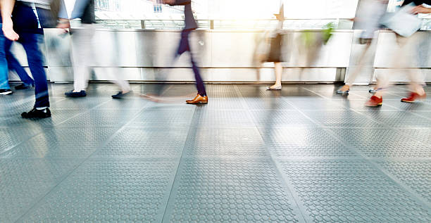 istock People walking in corridor at rush hour 2232553846