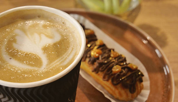istock Creamy Coffee and Craft Choco Eclair Cake Decorated with Gilded Nuts 2232556549