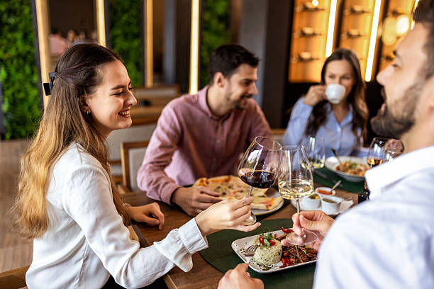 istock Colleagues Toast with Wine During Lunch at Restaurant 2232558056