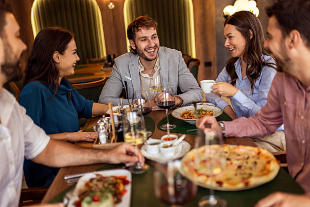 istock Colleagues Toast with Wine During Lunch at Restaurant 2232559097
