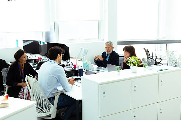 istock Business people working together in modern office 2232561030