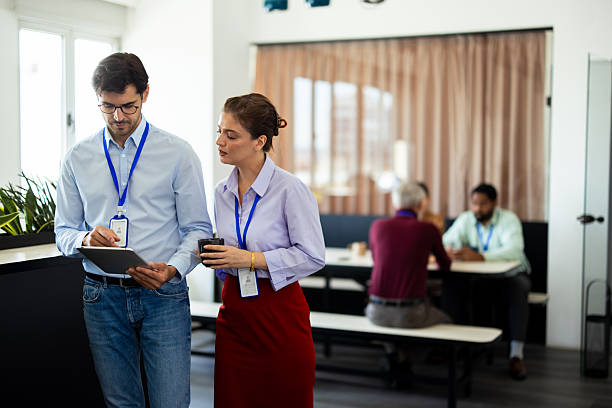 istock Business colleagues collaborating on digital tablet in modern office 2232561128