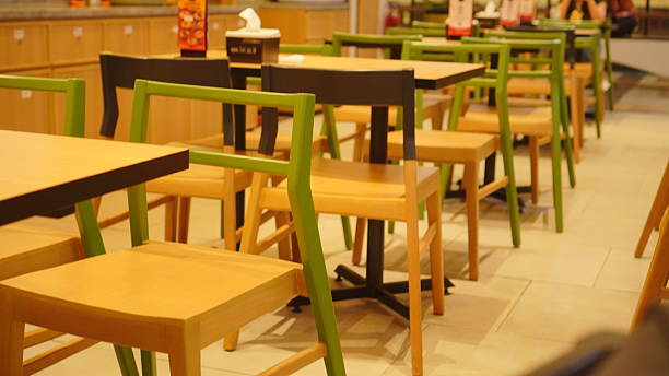 istock Modern Wooden Chairs and Tables in Empty Restaurant Interior 2232563202