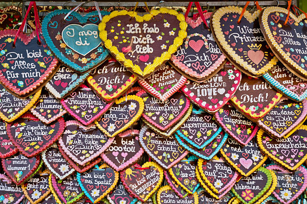 Decorated heart-shaped gingerbread cookies on a checkered background