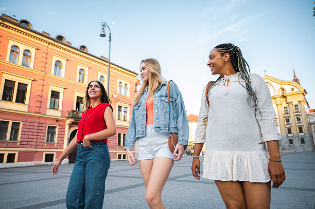 istock Young Women Strolling Together in Urban Setting 2232573589