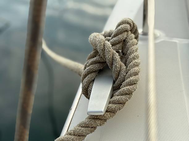Closeup view of ropes string with a knot isolated over a white background