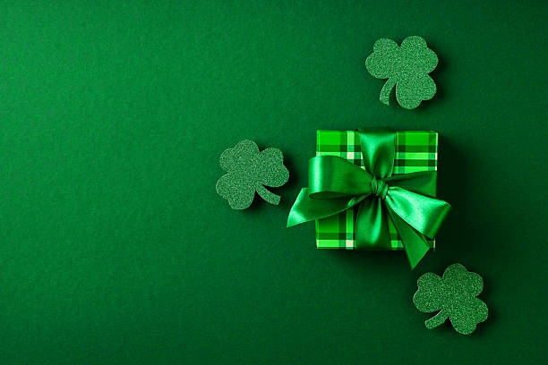 istock St. patric day background with gift and paper decoration 2232578181